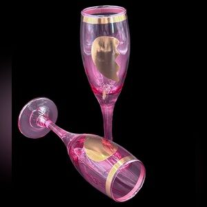 Pink Wine glasses with hearts designs.